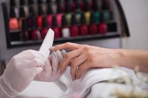 Woman hands receiving a manicure photo