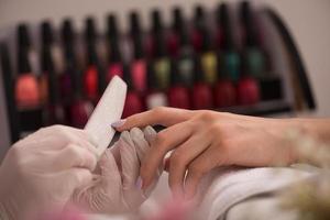 Woman hands receiving a manicure photo