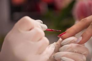 Woman hands receiving a manicure photo