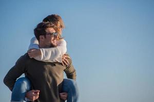 couple having fun at beach during autumn photo