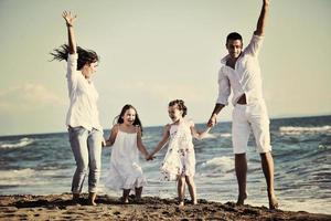 happy young  family have fun on beach photo