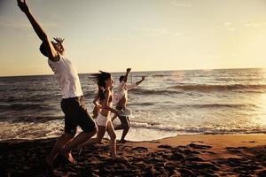 people group running on the beach photo