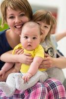 portrait of young mother with  her kids photo