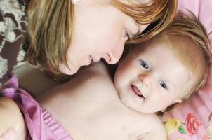 beautiful blonde young mother and cute baby photo