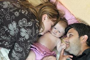 portrait of young family with  cute little babby photo