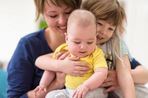 portrait of young mother with  her kids photo