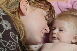 beautiful blonde young mother and cute baby photo