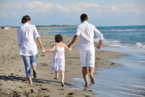 happy young  family have fun on beach photo