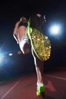 pixelated design of woman  sprinter leaving starting blocks photo