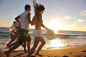 people group running on the beach photo