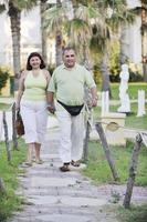 happy seniors couple  on beach photo