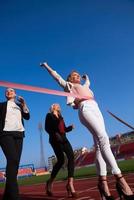 business people running on racing track photo