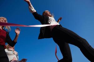 business people running on racing track photo