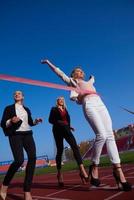 business people running on racing track photo