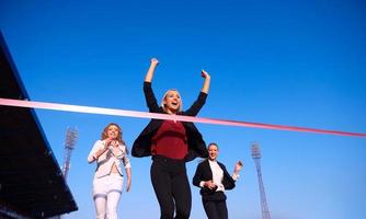 business people running on racing track photo