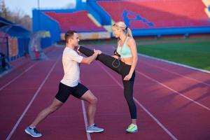 sporty woman on athletic race track photo