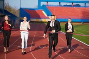 business people running on racing track photo