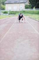 joven atleta en el inicio foto