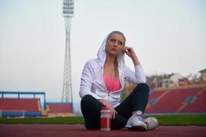 sporty woman on athletic race track photo