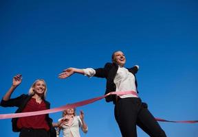 business people running on racing track photo