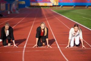 business people running on racing track photo