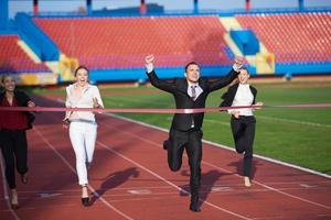 business people running on racing track photo