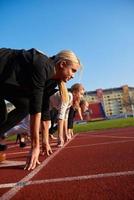 business people running on racing track photo