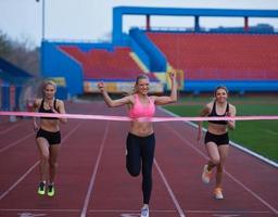 Female Runners Finishing Race Together photo