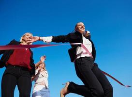 business people running on racing track photo