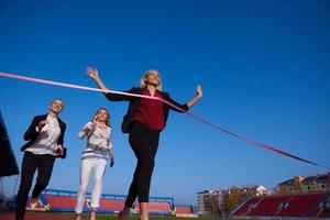 business people running on racing track photo