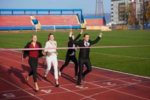 business people running on racing track photo