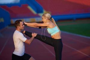 sporty woman on athletic race track photo