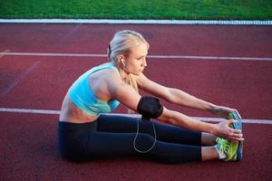 sporty woman on athletic race track photo