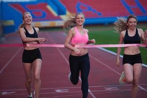 Female Runners Finishing Race Together photo