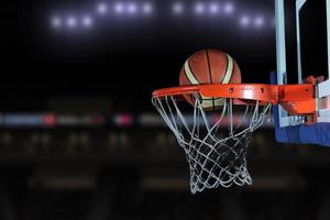 basketball ball and net on grey background photo