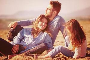 Young family enjoying vecation during autumn photo