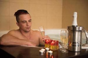 man relaxing in the jacuzzi photo