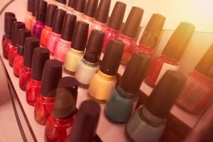 Set of different bottles of nail polish photo