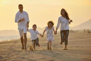 happy young family have fun on beach photo