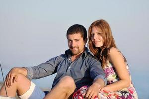 happy young couple have fun on beach photo