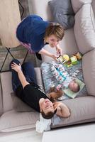 top view of happy mother and father taking picture of baby photo