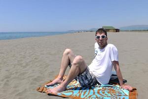 man relax on beach photo