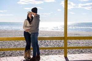 Couple chating and having fun at beach bar photo