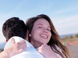 young couple  on beach have fun photo