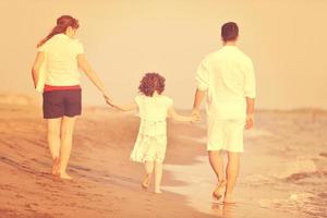 happy young family have fun on beach photo