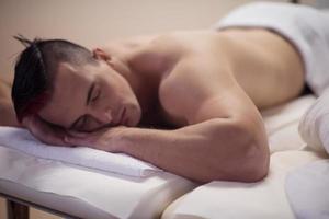 handsome man resting in a spa massage center photo