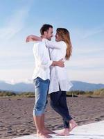 young couple  on beach have fun photo