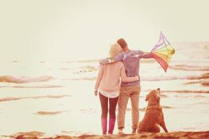 happy couple enjoying time together at beach photo