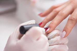 Woman hands receiving a manicure photo