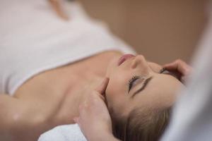 woman receiving a head massage photo